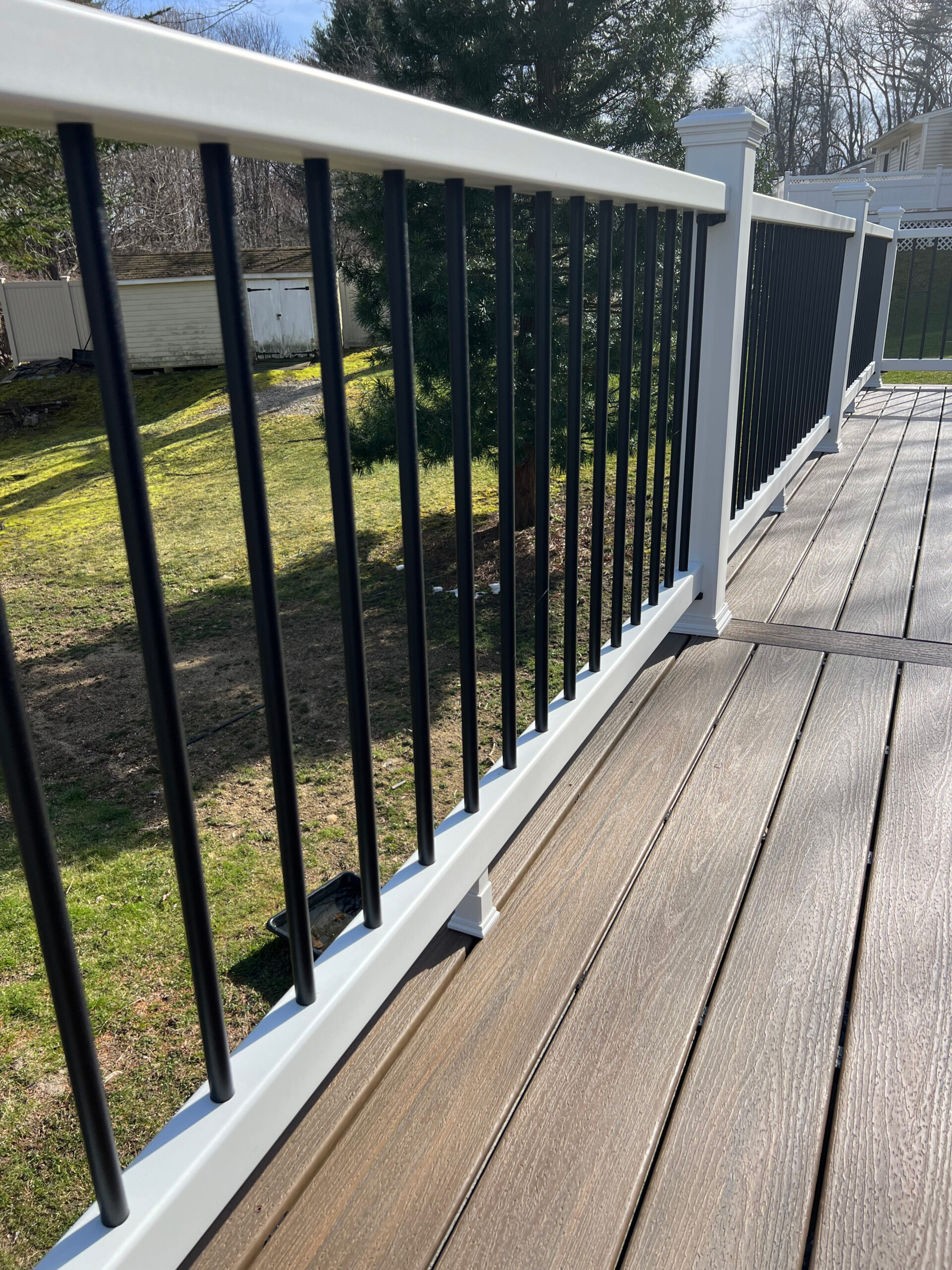 Trex select white railings with black balusters from Central MA trex deck installers